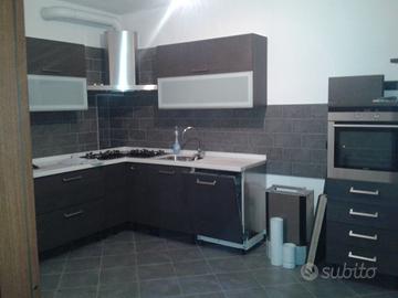 Cucina Angolare COMPREX con piano in CORIAN