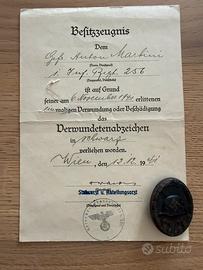 Distintivo tedesco feriti 3 Cl. + certificato WW2