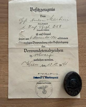 Distintivo tedesco feriti 3 Cl. + certificato WW2