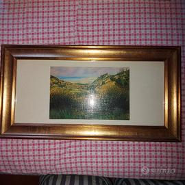 Piccole stampe in cornice di legno dorato