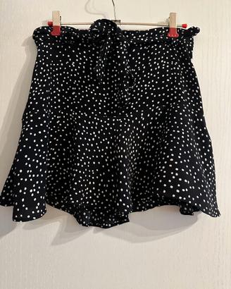 Gonna-pantaloni nera a pois bianchi