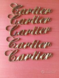 Logo originale Cartier in ottone fuso