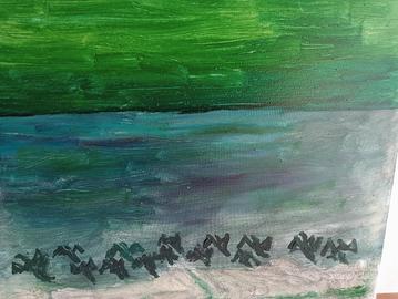 Anatre che spiccano il volo al lago