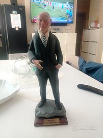 statua 