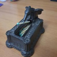 scultura uccello porta cerino in lega