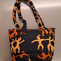 borsa in tessuto nero e arancione 