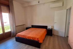 Camera singola con bagno privato e balcone