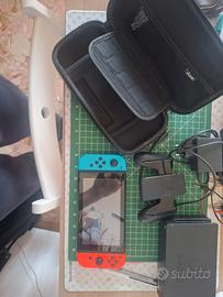 nintendo switch con giochi e accessori