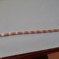 Elegante bracciale da uomo con inserti dorati.  -