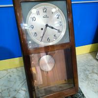 Orologio a pendolo a muro antico vintage 
