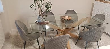 Tavolo di cristallo con sei sedie