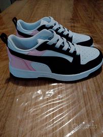 Puma Rebound V6 Low in bianco, nero e rosa