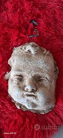 piccolo putto di gesso