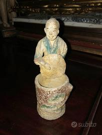 Statua figura oriente antico raccoglitore di grano