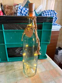 Bottiglia vetro + luci e centrotavola con conchigl