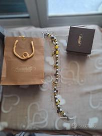 Bracciale con pietre gialle e condoli