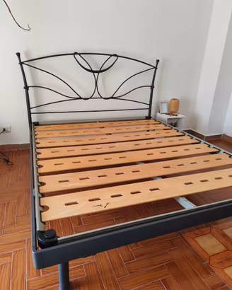 Letto e rete in ferro battuto