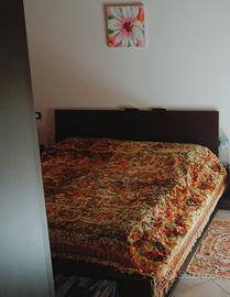 letto matrimoniale contenitore e a libreria