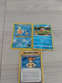 tre carte Pokemon Magikarp e allenatore una brilla
