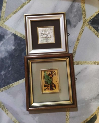 2 quadretti con piastra in argento