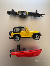 Jeep con rimorchio e canotto rosso