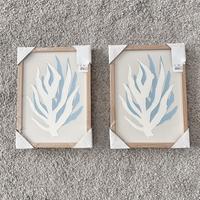 Coppia di quadri bianchi e azzurri