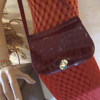 borsa in coccodrillo e cintura abbinata in pitone