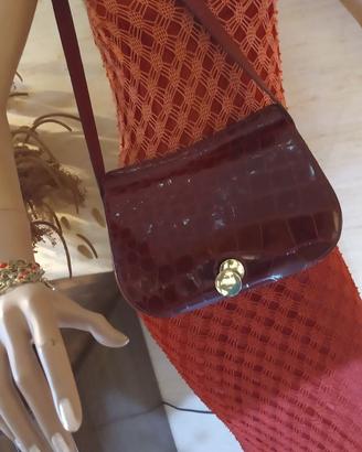 borsa in coccodrillo e cintura abbinata in pitone