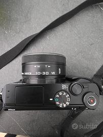 Macchina fotografica Nikkon J5 compatta