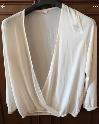Blusa con manica lunga