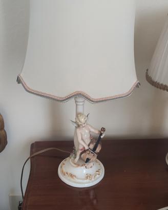 coppia lumi in ceramica da comodino con puttini