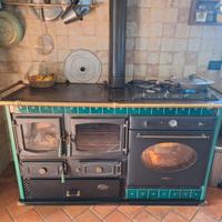 Stufa a legna Anselmo Cola con forno-fornelli SMEG