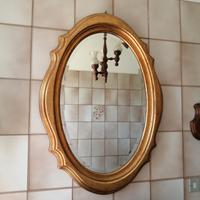 specchiera dorata ovale