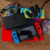 Nintendo Switch + 3 giochi + accessori e custodie