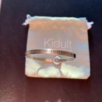 Originale bracciale Kidult in acciaio con frase.