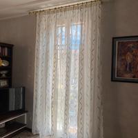Tenda con motivi elicoidali color crema e bronzo