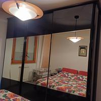 camera da letto nera lucida