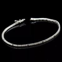 BRACCIALE TENNIS ORO 18KT BRILLANTI NERI E BIANCHI