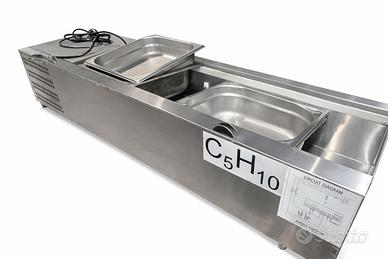 Porta vaschette riscaldato in acciaio.