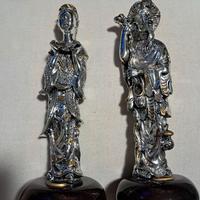 coppia statue cinesi argentate