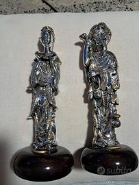 coppia statue cinesi argentate
