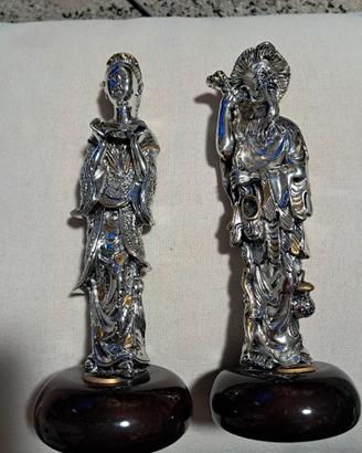 coppia statue cinesi argentate