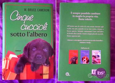 Cinque cuccioli sotto l'albero