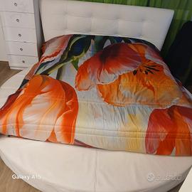 letto rotondo pelle bianca