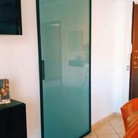 PORTA SCORREVOLE IN CRISTALLO