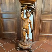 Statua in legno con portavaso