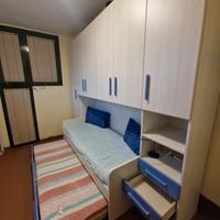 Armadio a ponte 6 ante battenti e 4 cassetti