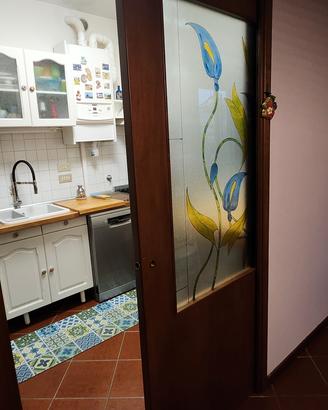 Porta scorrevole con vetro