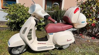 Vespa e casco Peg Perego
