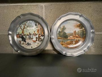 Coppia piatti in ceramica con bordo in peltro '70